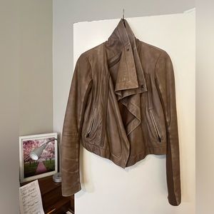 brown leather jacket with zipper pockets and snap button collar.Sz small